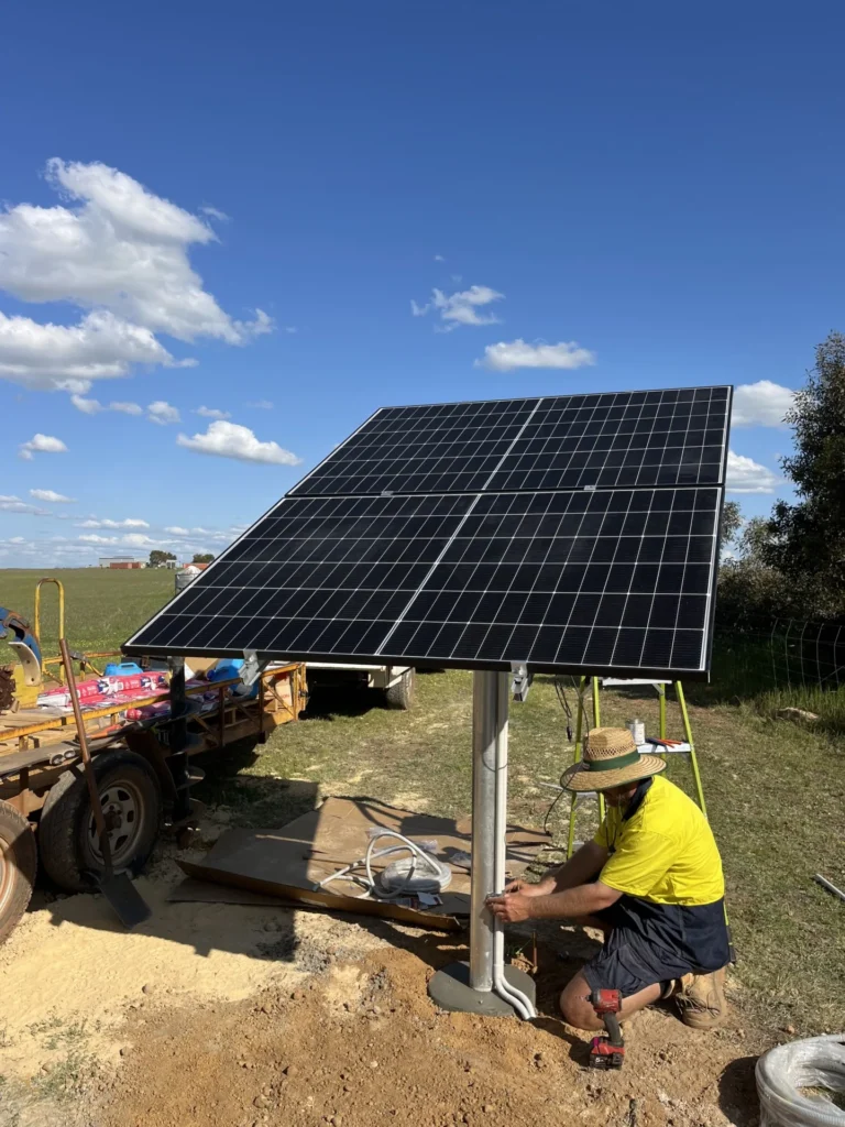 a man working on a solar panel