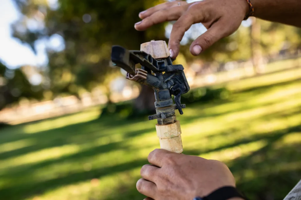 Adjusting a sprinkler head